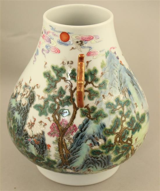 A Chinese famille verte pear shaped vase, Hu, 21cm